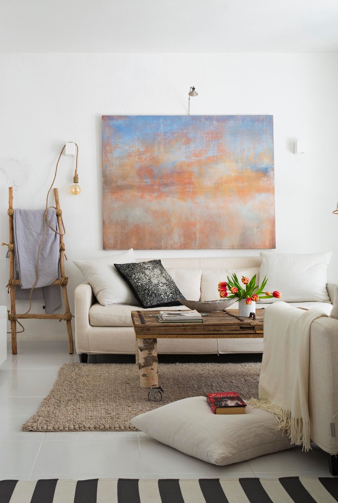 На фото: парадная, изолированная гостиная комната среднего размера:: освещение в средиземноморском стиле с белыми стенами и полом из керамогранита без камина, телевизора