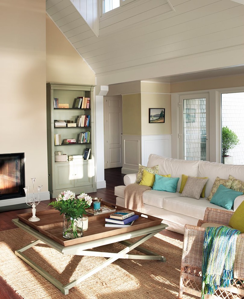 Example of a mid-sized classic formal and open concept dark wood floor living room design in Other with beige walls, a standard fireplace, a metal fireplace and a tv stand