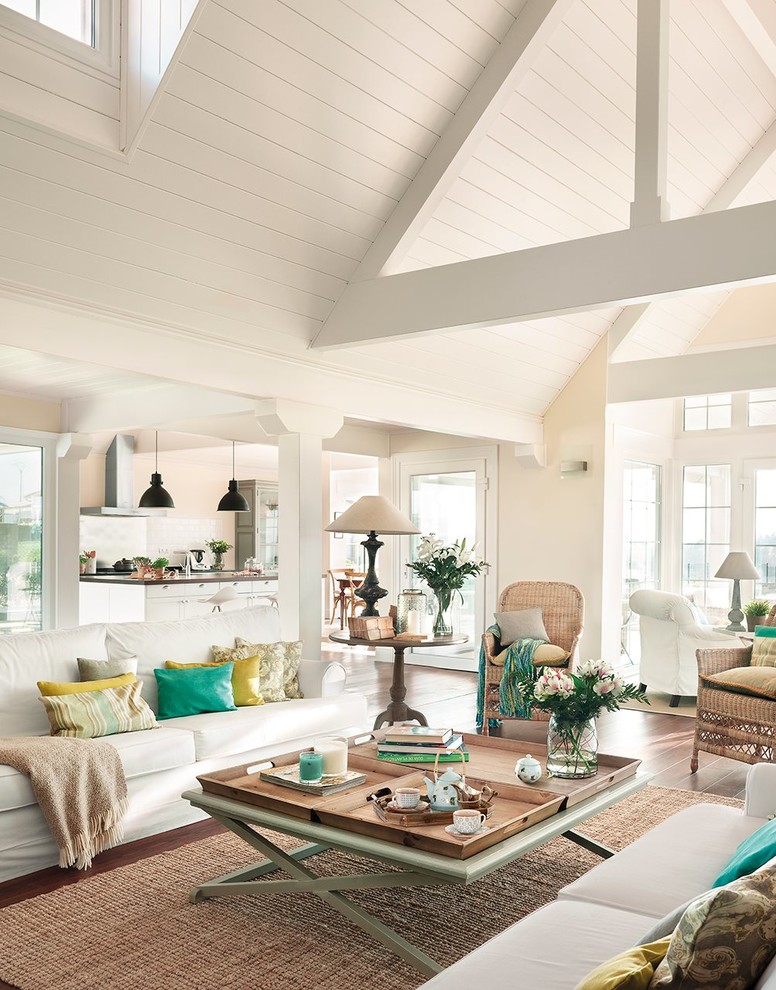Example of a mid-sized classic formal and open concept dark wood floor living room design in Other with beige walls and a tv stand