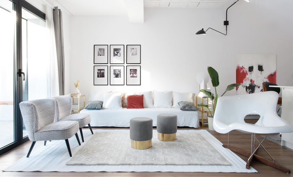 Inspiration for a contemporary open concept dark wood floor and brown floor living room remodel in Other with white walls