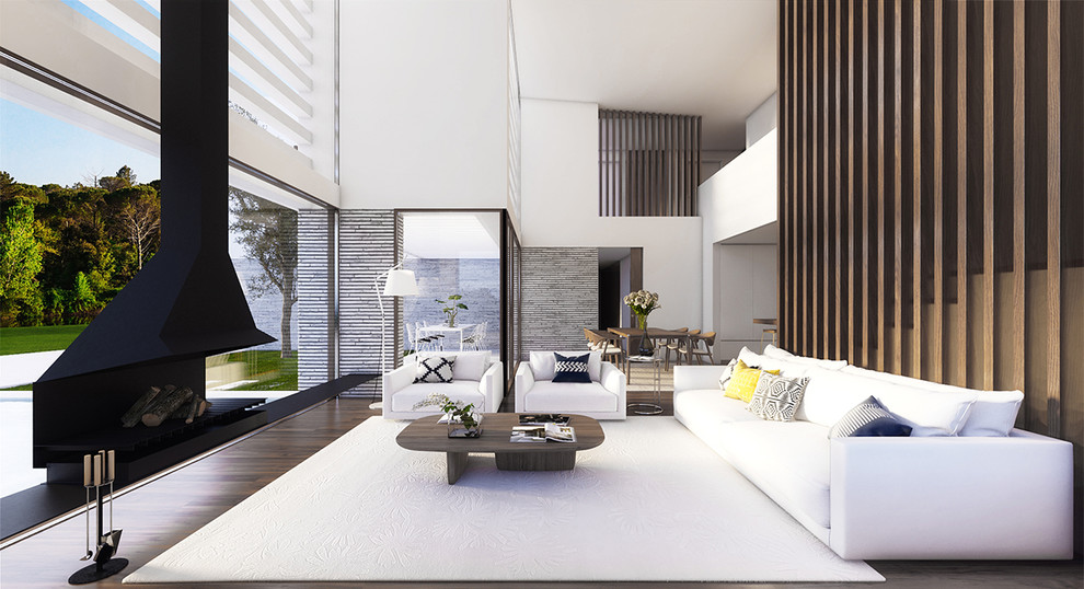 Стильный дизайн: большая парадная, открытая гостиная комната в современном стиле с белыми стенами, паркетным полом среднего тона и подвесным камином без телевизора - последний тренд