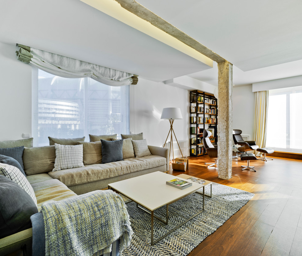 This is an example of a large contemporary formal open plan living room in Alicante-Costa Blanca with white walls, dark hardwood flooring, no fireplace and no tv.