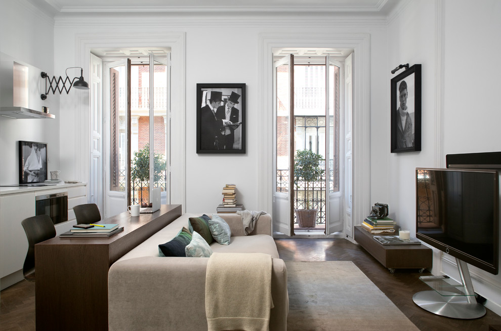 Example of a mid-sized danish open concept and formal dark wood floor living room design in Madrid with white walls, no fireplace and a tv stand