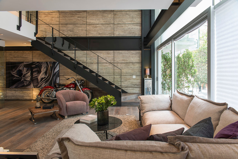 Inspiration for a contemporary open plan living room in Mexico City with dark hardwood flooring.
