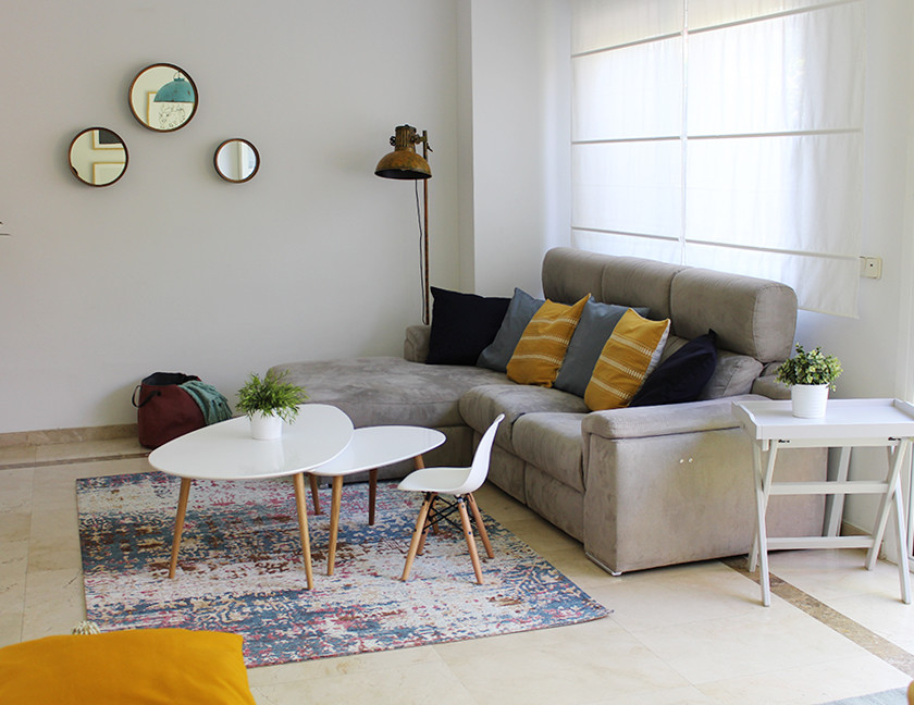 Photo of a small scandi enclosed living room in Madrid with grey walls, marble flooring and beige floors.