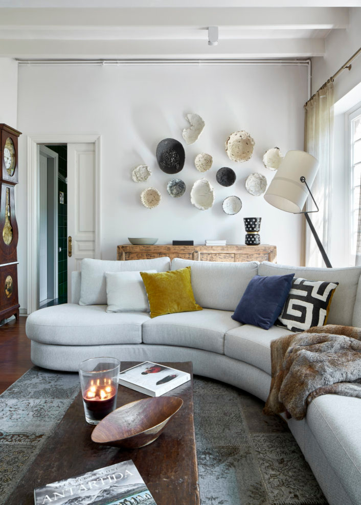 This is an example of a medium sized classic formal open plan living room in Barcelona with white walls.