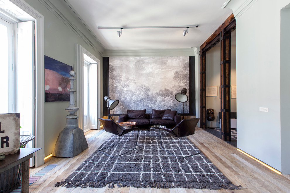 Photo of a large classic formal open plan living room in Madrid with green walls, light hardwood flooring, no fireplace and no tv.