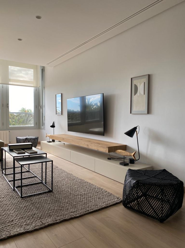 Photo of a scandi living room in Alicante-Costa Blanca with white walls and light hardwood flooring.