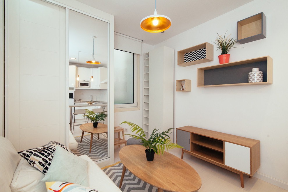Small scandi formal open plan living room in Madrid with white walls, no fireplace and no tv.