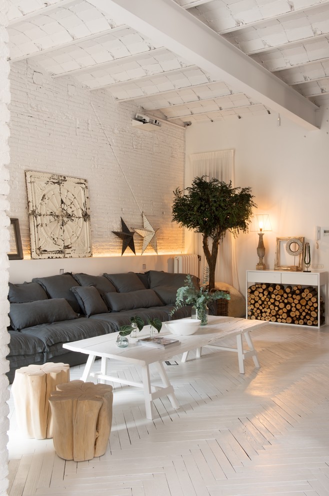 Inspiration for a mid-sized scandinavian open concept and formal painted wood floor living room remodel in Other with white walls and no tv