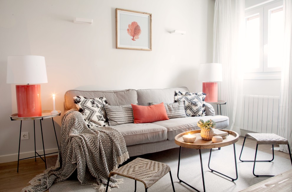 Living room - scandinavian formal medium tone wood floor and beige floor living room idea in Bilbao with white walls