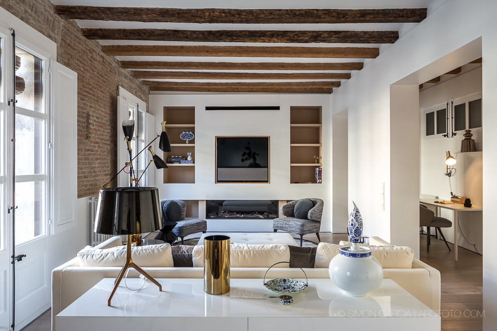 Medium sized contemporary formal open plan living room in Barcelona with white walls, dark hardwood flooring, a ribbon fireplace and a built-in media unit.