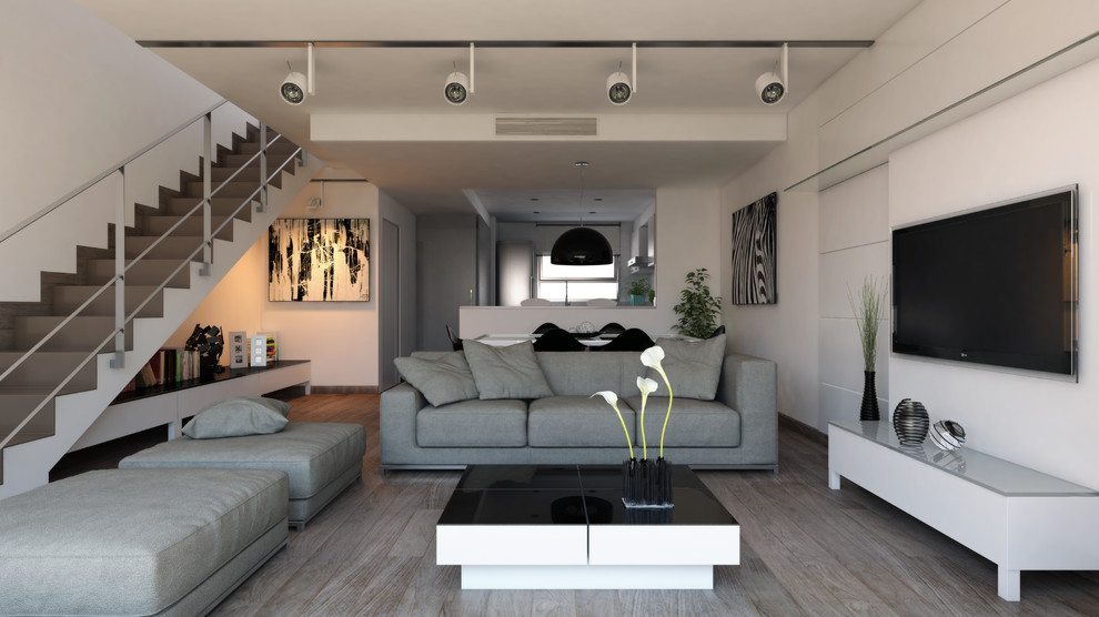 Immagine di un grande soggiorno minimal aperto con sala formale, pareti bianche, nessun camino e TV a parete