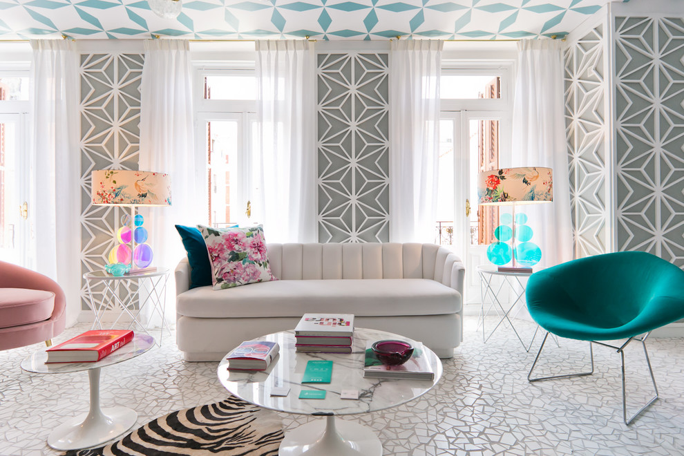 This is an example of an eclectic grey and teal living room in Madrid with grey walls and white floors.