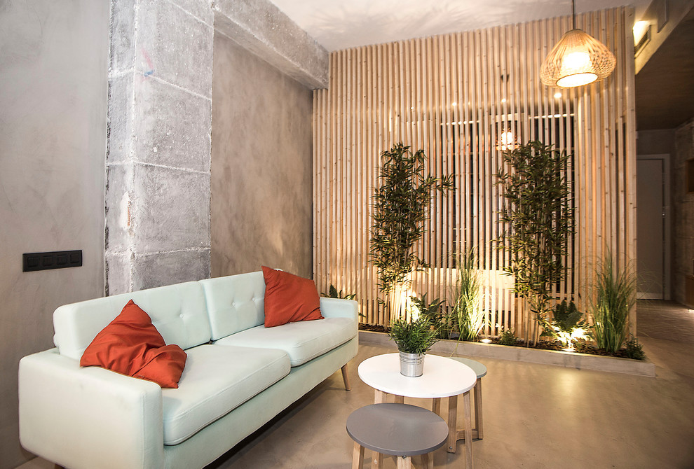 Idee per un piccolo soggiorno industriale stile loft con pareti grigie, pavimento grigio, sala formale e pavimento in cemento