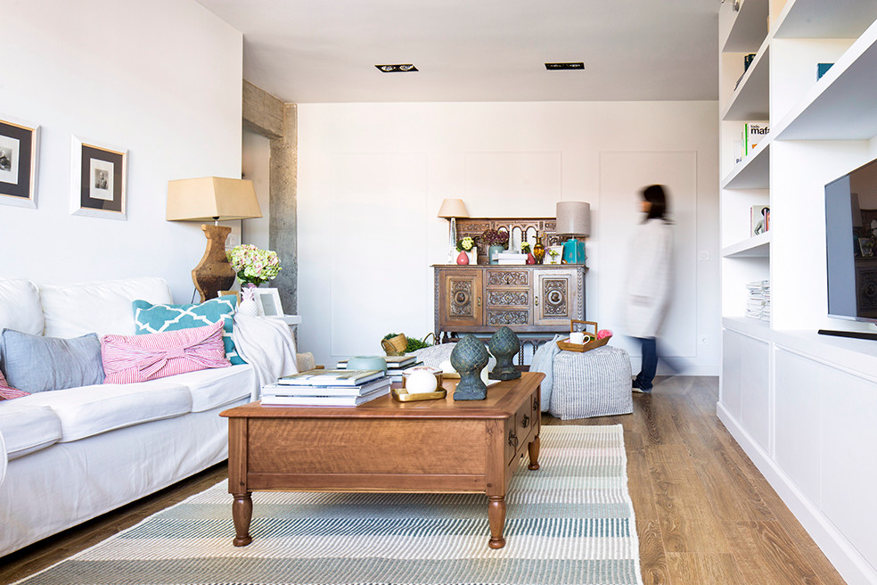 This is an example of a medium sized romantic formal enclosed living room in Bilbao with white walls and medium hardwood flooring.