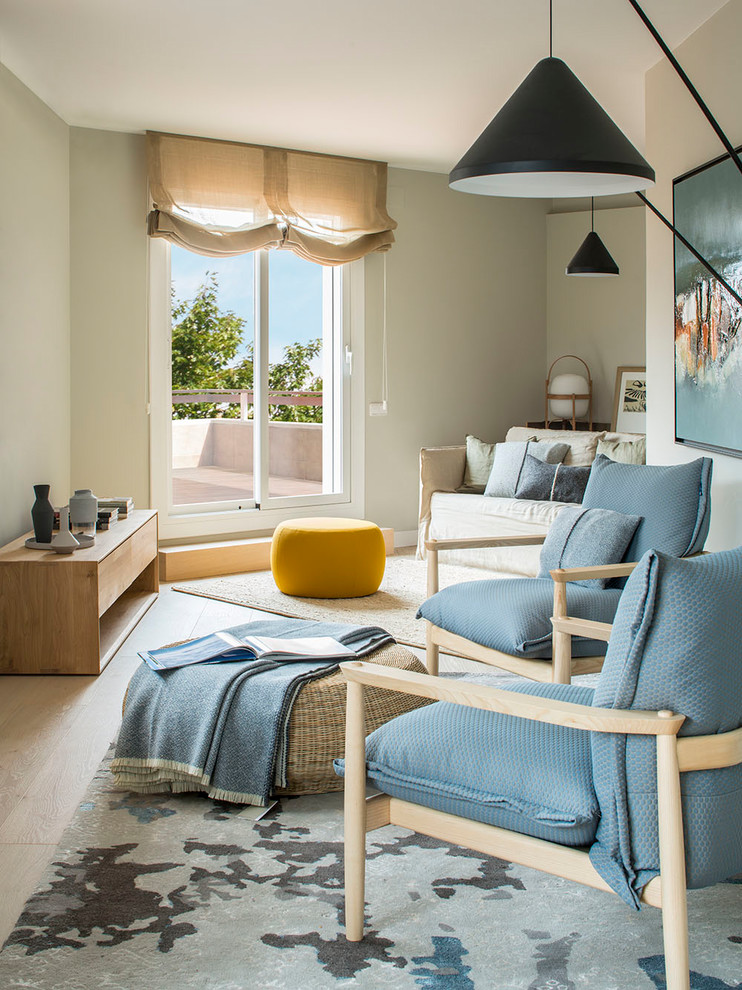 Living room - mid-sized coastal open concept light wood floor and brown floor living room idea in Barcelona with beige walls