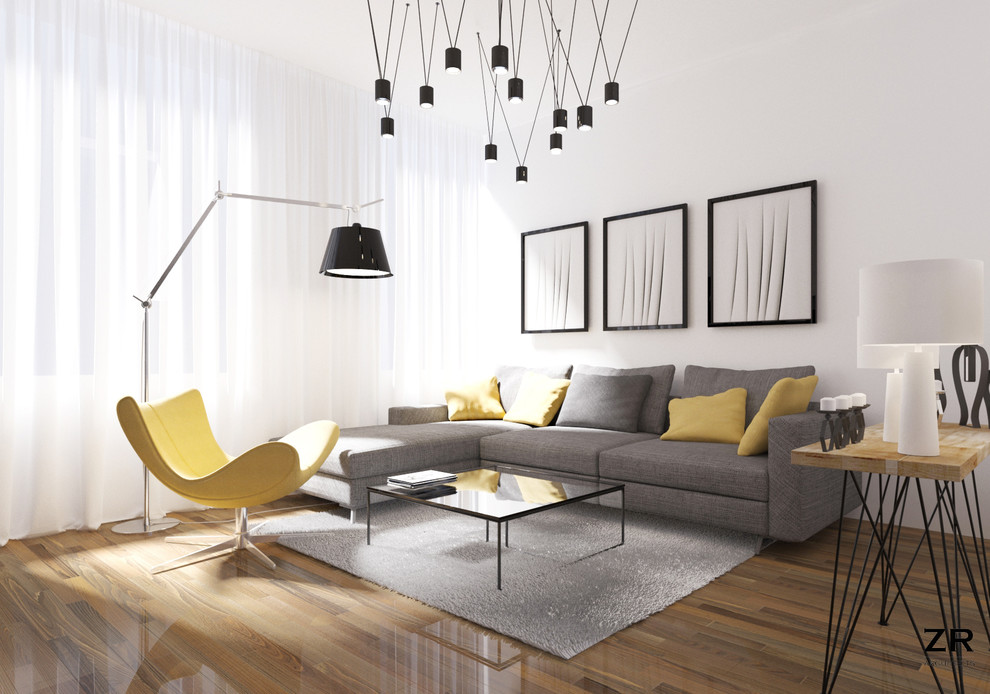 Photo of a small modern grey and yellow open plan living room in Brussels with white walls, medium hardwood flooring, no fireplace and a wall mounted tv.