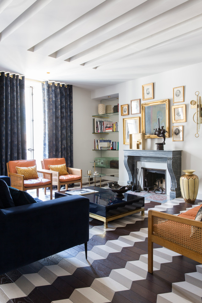 Photo of an eclectic living room in Paris with white walls, a standard fireplace and multi-coloured floors.