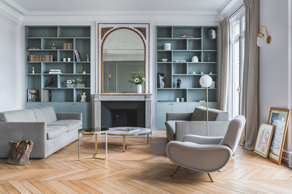 Inspiration for a transitional formal medium tone wood floor and brown floor living room remodel in Paris with white walls, a standard fireplace, a brick fireplace and no tv