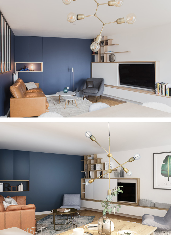 Foto di un soggiorno minimalista di medie dimensioni e aperto con pareti blu, parquet scuro, nessun camino, TV nascosta e pavimento marrone