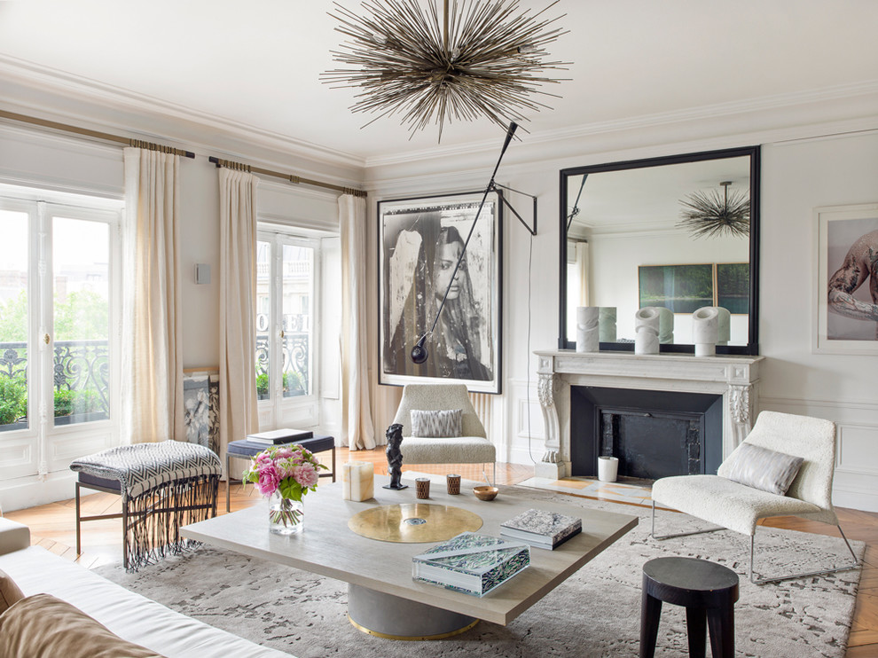 Inspiration for a large contemporary formal and enclosed medium tone wood floor living room remodel in Paris with white walls, a standard fireplace, a stone fireplace and no tv