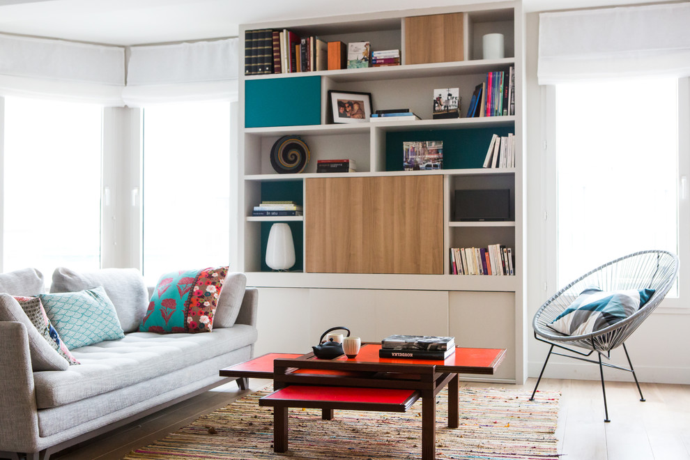 Mid-sized trendy formal and enclosed light wood floor living room photo in Paris with white walls, no fireplace and no tv