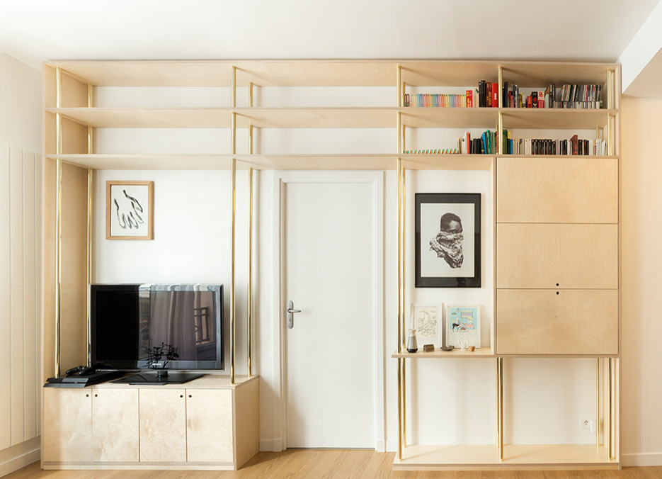 Inspiration for a small contemporary open plan living room in Paris with a reading nook, white walls, light hardwood flooring, no fireplace, a freestanding tv and beige floors.