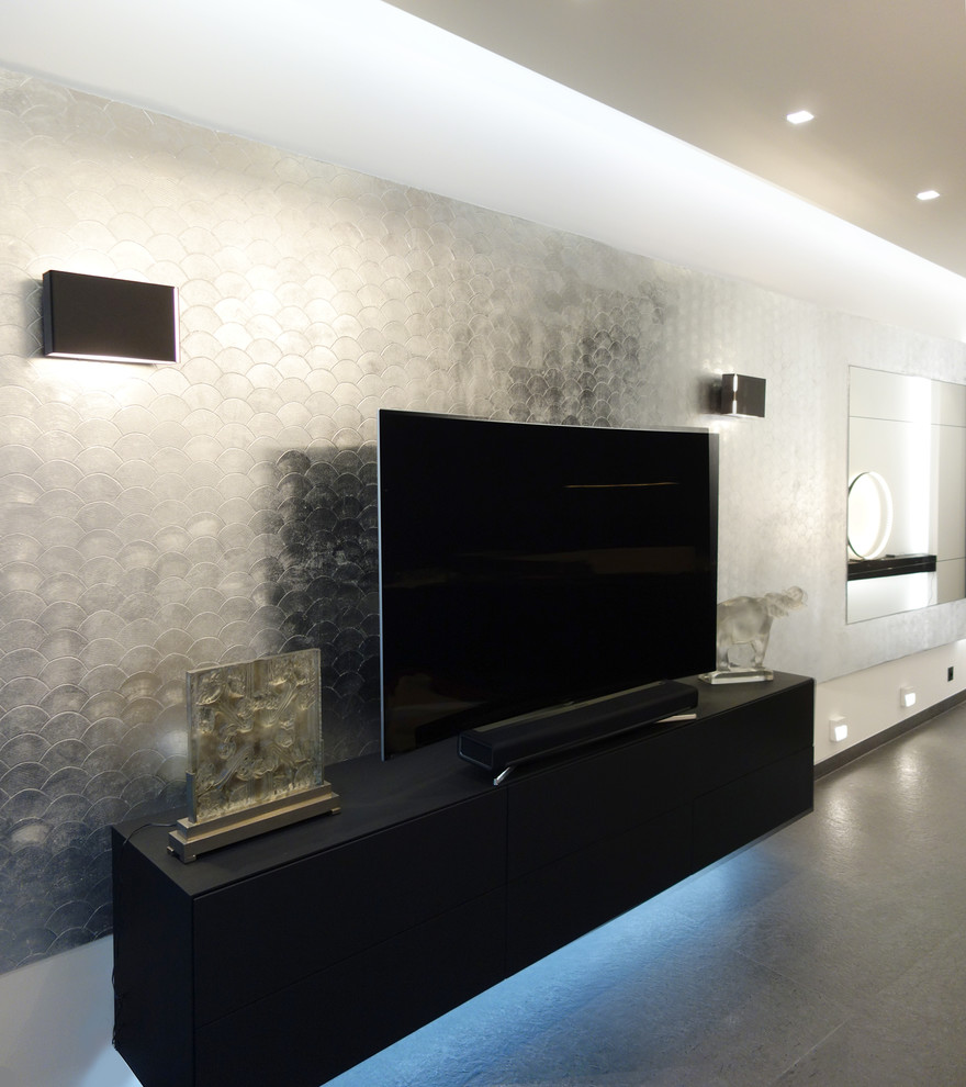 Photo of a small contemporary open plan living room in Paris with grey walls, slate flooring, a wall mounted tv, no fireplace and grey floors.