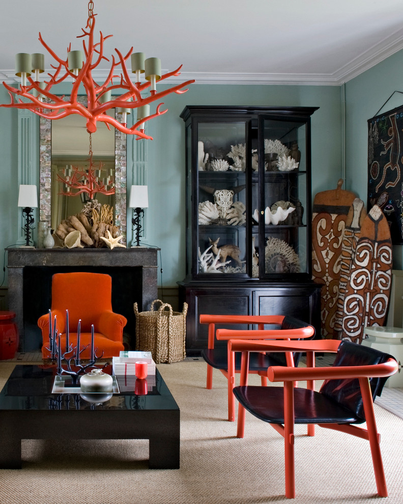 Inspiration for a mid-sized tropical formal light wood floor living room remodel in Paris with blue walls, a standard fireplace and no tv
