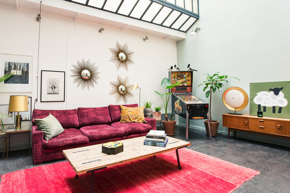 Immagine di un soggiorno contemporaneo di medie dimensioni e aperto con pavimento in cemento, pareti verdi, nessun camino, nessuna TV e pavimento grigio