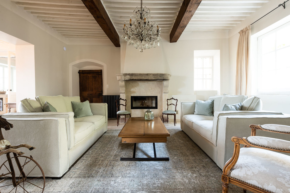 Immagine di un soggiorno shabby-chic style con sala formale, pareti bianche e camino lineare Ribbon