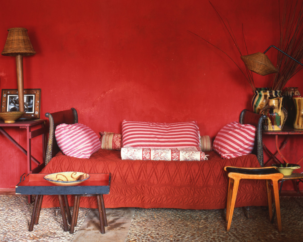 Design ideas for a medium sized bohemian open plan living room in Paris with red walls, no fireplace and no tv.