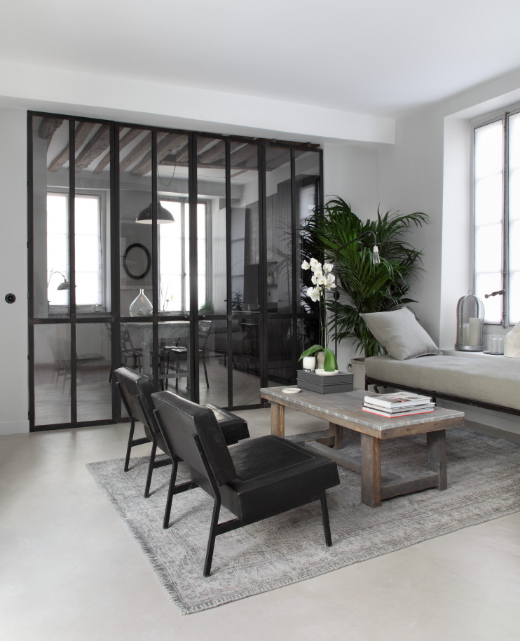 Mid-sized trendy enclosed living room photo in Paris with white walls