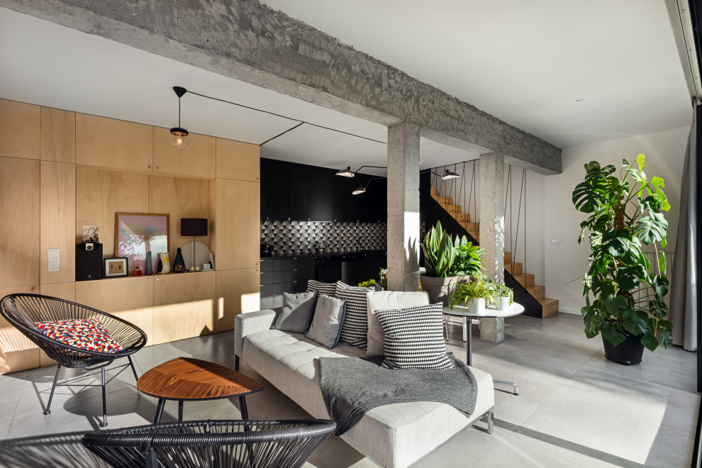 Esempio di un soggiorno design di medie dimensioni e aperto con pareti bianche e pavimento grigio