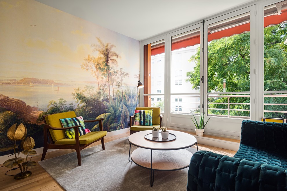 Inspiration for an eclectic medium tone wood floor and brown floor living room remodel in Paris with multicolored walls