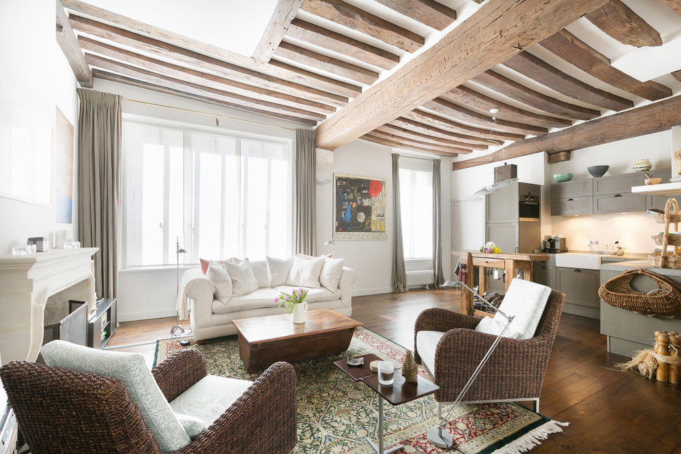 Inspiration for a large farmhouse open plan living room in Paris with white walls, medium hardwood flooring, a standard fireplace, a stone fireplace surround and no tv.