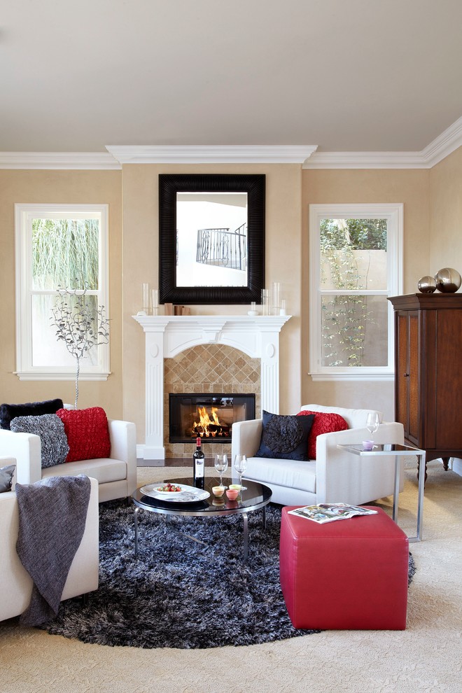 Design ideas for a traditional living room in Orange County with beige walls and a standard fireplace.