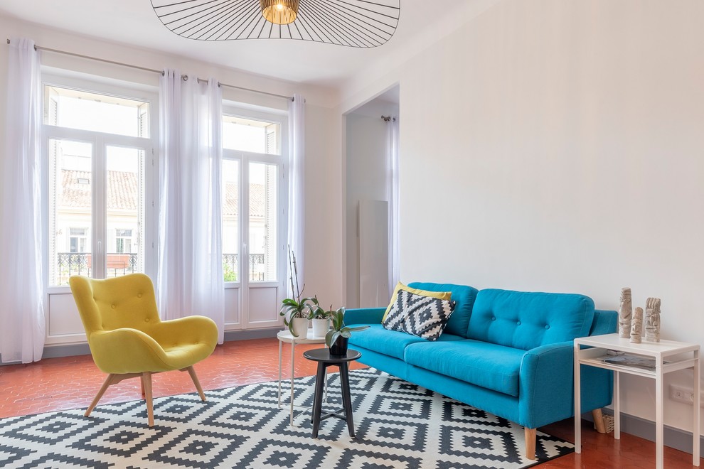 Design ideas for a large scandi enclosed living room in Marseille with white walls, orange floors and terracotta flooring.