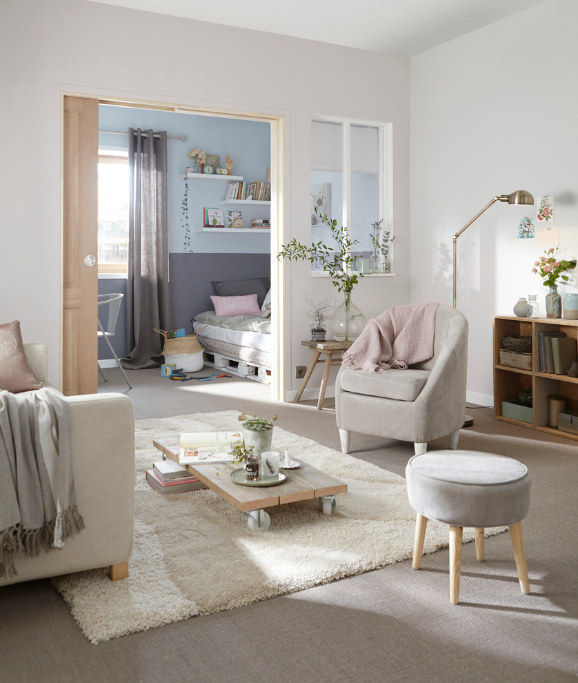 Living room - mid-sized contemporary enclosed carpeted living room idea in Lille with white walls, no fireplace and no tv