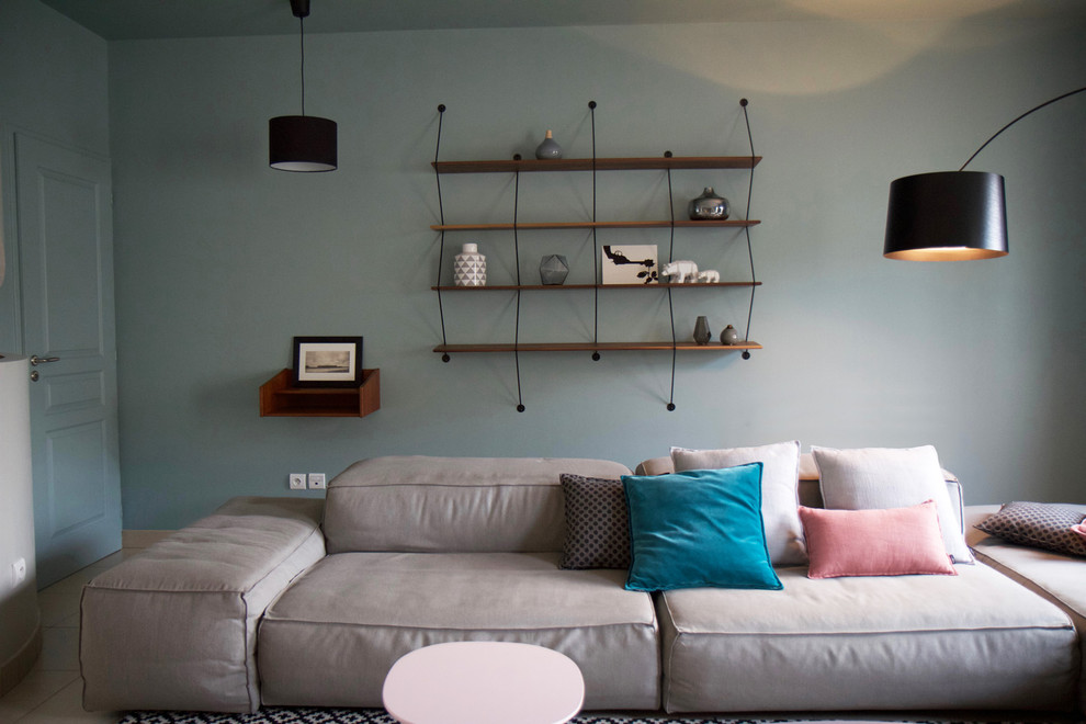 Exempel på ett mellanstort modernt separat vardagsrum, med blå väggar