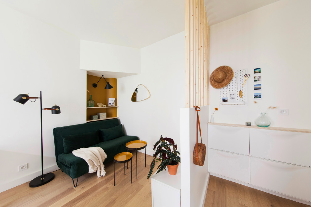 Photo of a small scandinavian open plan living room in Paris with no tv.