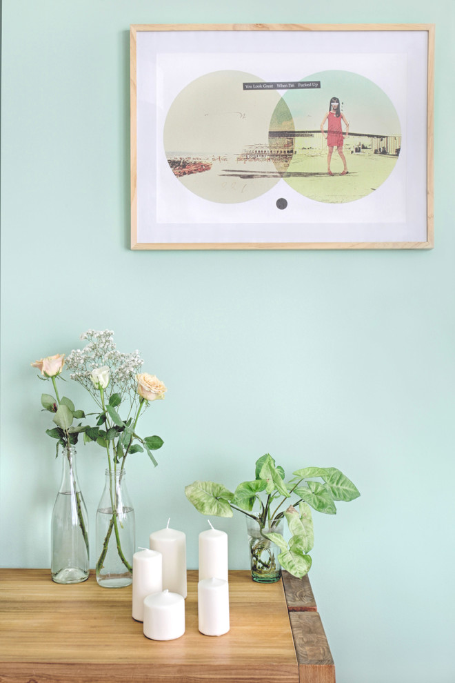 Medium sized scandi open plan living room in Paris with green walls.