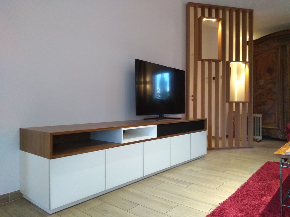 Large trendy open concept beige floor living room photo in Lyon with white walls and a tv stand