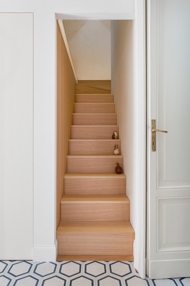 Mid-sized trendy wooden straight staircase photo in Milan with wooden risers