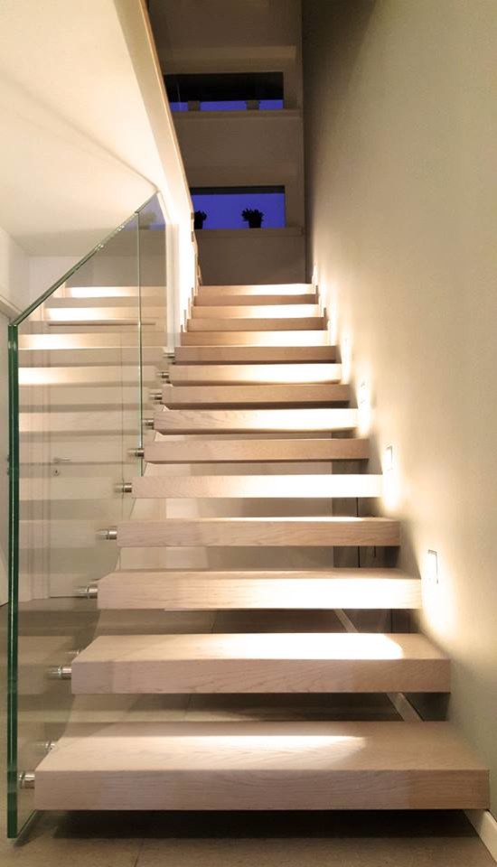 Staircase - large modern wooden straight open and glass railing staircase idea in Other