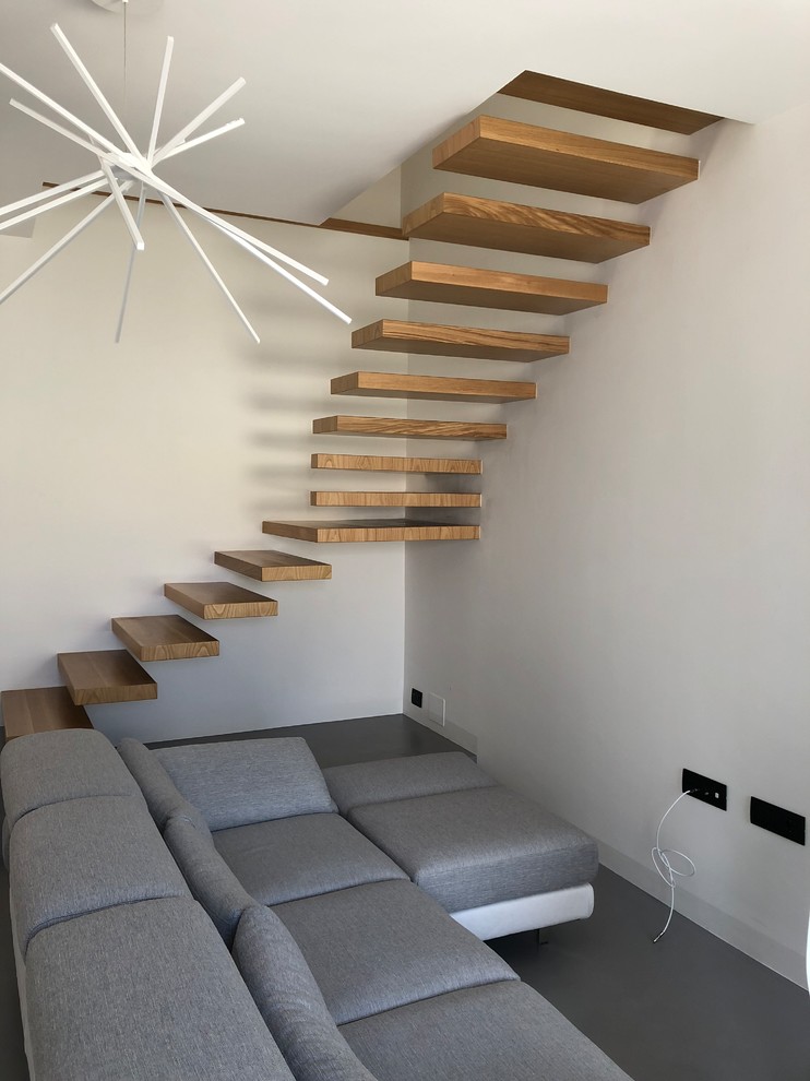 This is an example of a contemporary staircase in Catania-Palermo with feature lighting.
