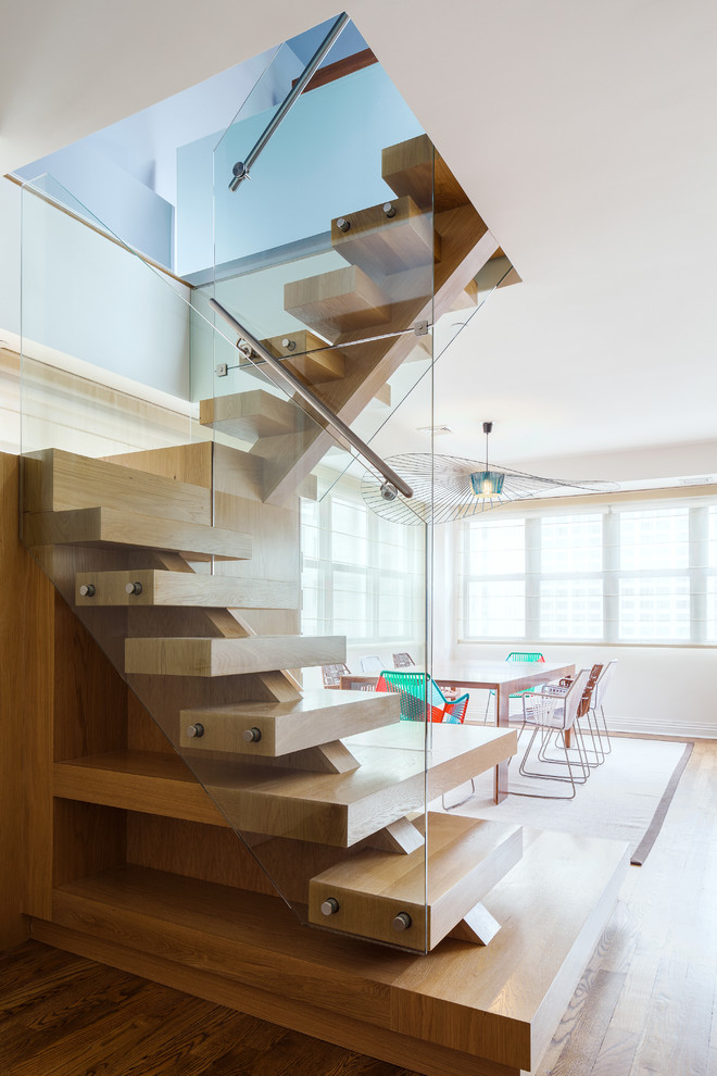 Example of a trendy wooden u-shaped open staircase design in New York