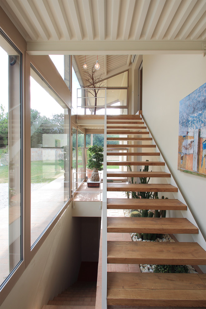 Inspiration for a medium sized contemporary wood straight staircase in Other.