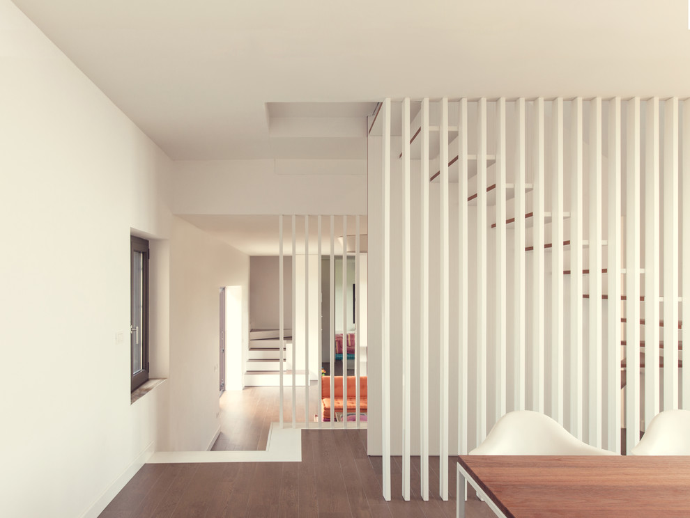 Inspiration for a contemporary wooden floating staircase remodel in Milan